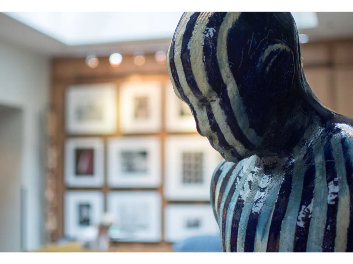 A thoughtfully curated section of the hotel displaying a bold striped sculpture and striking artwork on the wall. The space inspires reflection and creative conversation, embodying the hotel's artistic ambiance.
